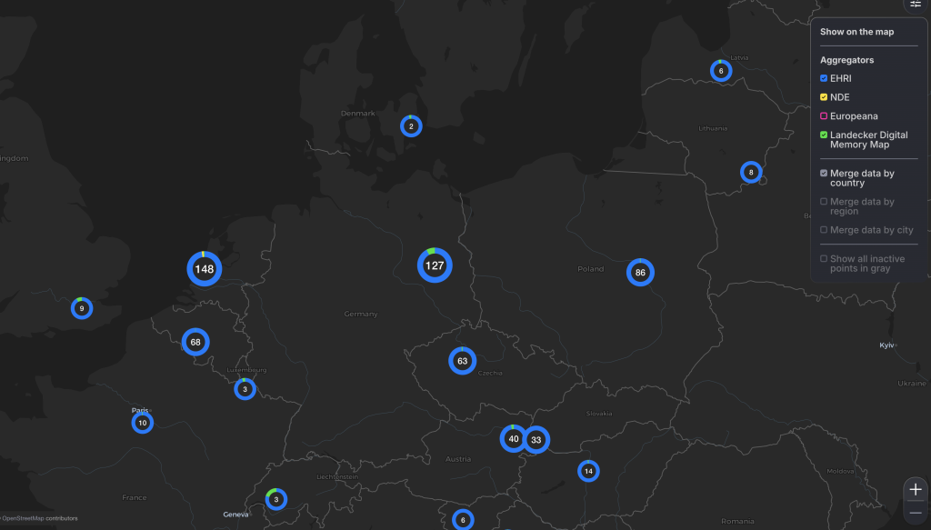 A dark-themed digital map of Central and Eastern Europe showing clusters of archival records related to Holocaust memory. Blue circles with white numbers indicate the number of data points in each region, such as 148 in the Netherlands, 127 in Germany, and 86 in Poland. A colour-coded legend on the right shows contributing sources: EHRI (blue), NDE (yellow), Europeana (pink), and Landecker Digital Memory Map (green). Checkboxes allow toggling between data aggregation by country, region, or city.